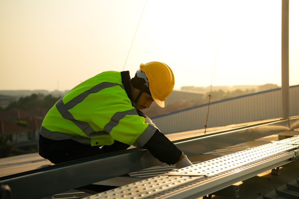 Technicians provide quarterly solar cell maintenance services on the factory roof